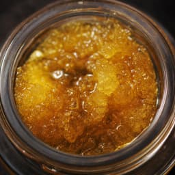 Macro of live resin sauce with THCA diamonds
