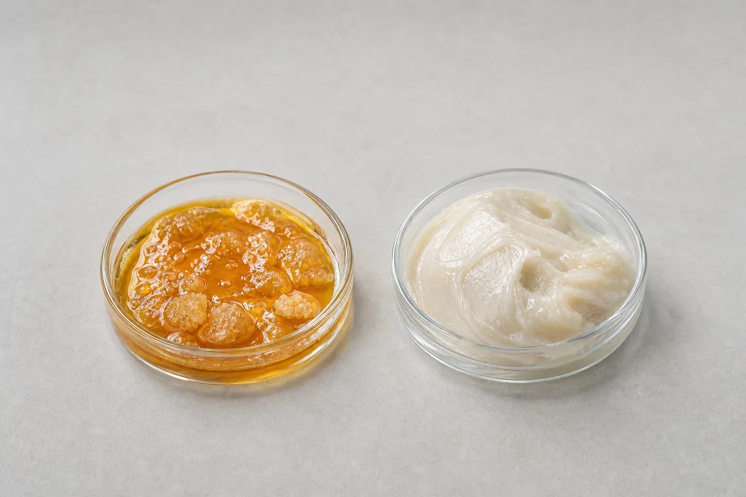 Saucy live resin in a dish beside buttery live rosin in a dish